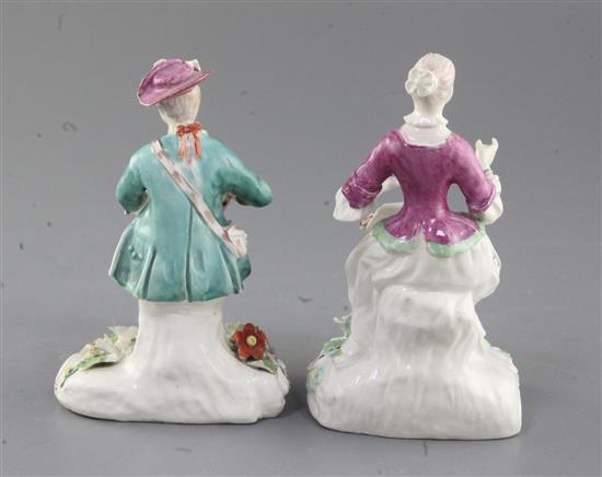 Two Derby Pale Family seated figures of a gentleman and a lady, c.1756-8, h. 13.3cm and 13.8cm, restorations